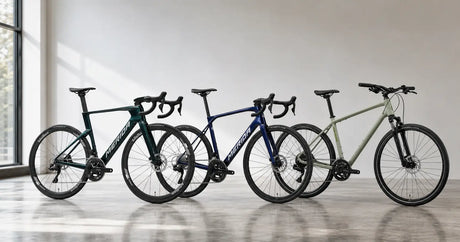 Three Merida bicycles lined up in a showroom, aero road, lightweight road and hybrid