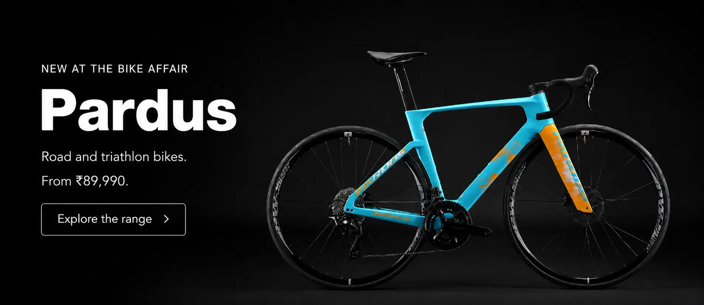 Pardus Spark Sport road bicycle on an open road at sunrise, now available at The Bike Affair